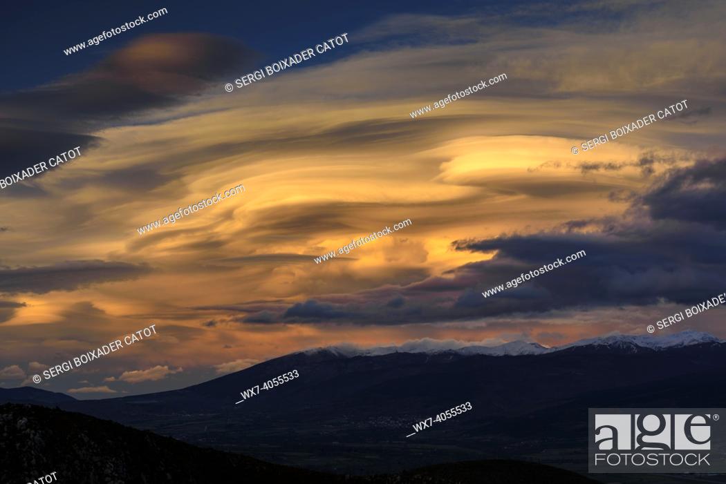 Stock Photo: Spring sunset in La Cerdanya, seen from near Ordèn, with lenticular clouds over Puigmal - Cambredase (Lleida, Catalonia, Spain, Pyrenees).
