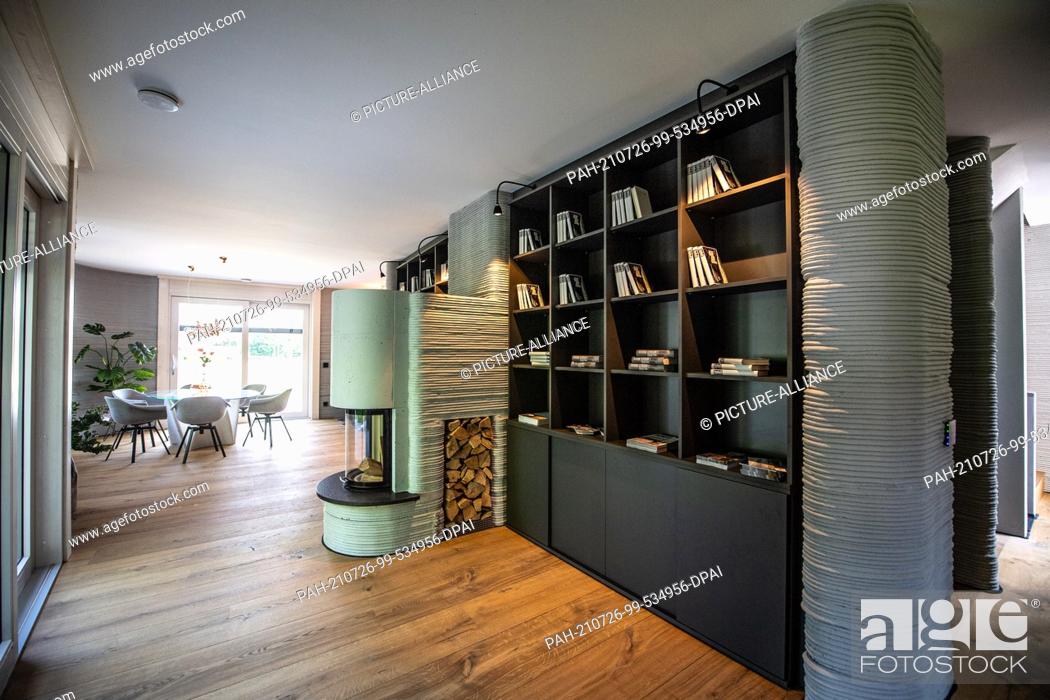 Stock Photo: 26 July 2021, North Rhine-Westphalia, Beckum: In the living and dining room area of the first 3D printed house, one can see the concrete layers applied by means.