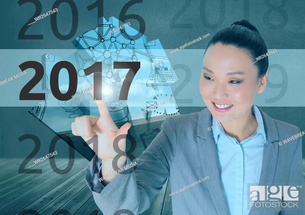 Stock Photo: Business woman in 3D digitally generated background touching 2017.