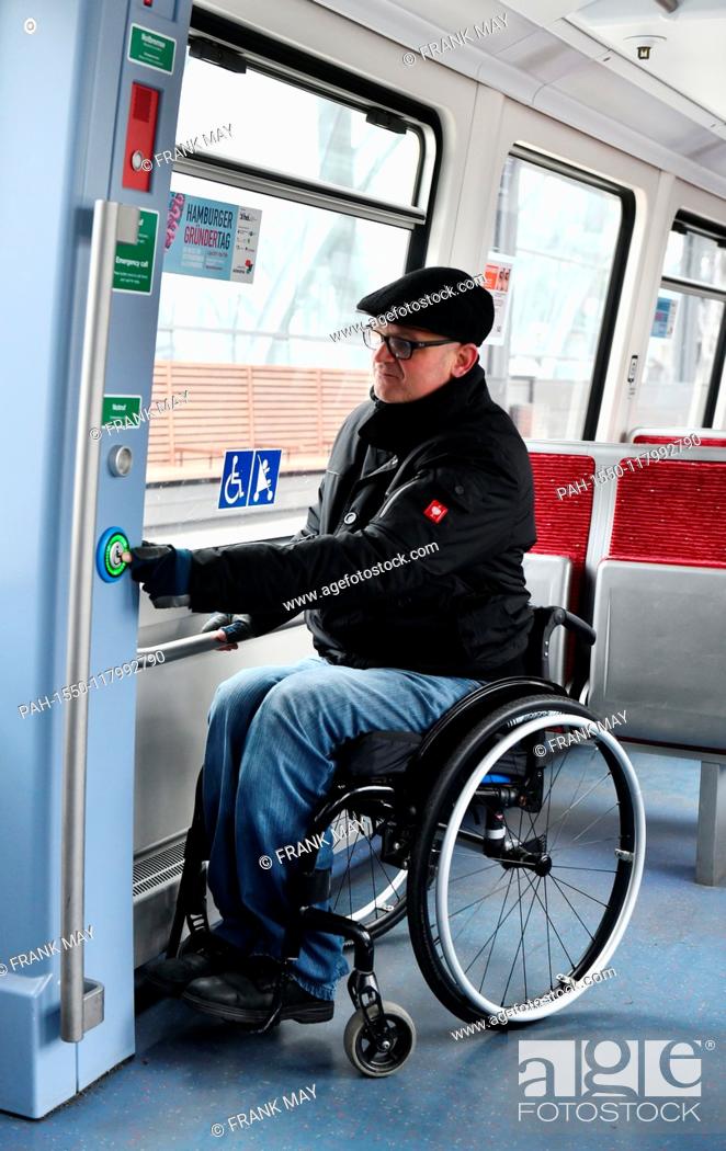 Stock Photo: A Wheelchair user in a train, Germany, city of Hamburg, 05. March 2019. Photo: Frank May (model released) | usage worldwide.