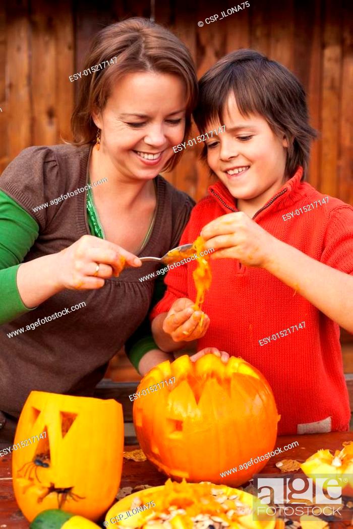 Stock Photo: Fun time carving a jack-o-lantern for Halloween.