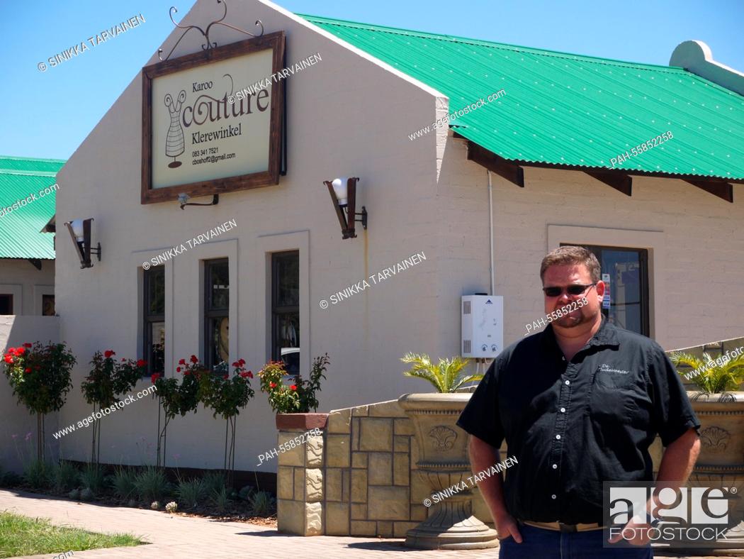 Stock Photo: Local Businessman Sarel Roets, who owns one of Orania's shopping centres, stands in front of one of the buildings belonging to the shopping centre in Orania.