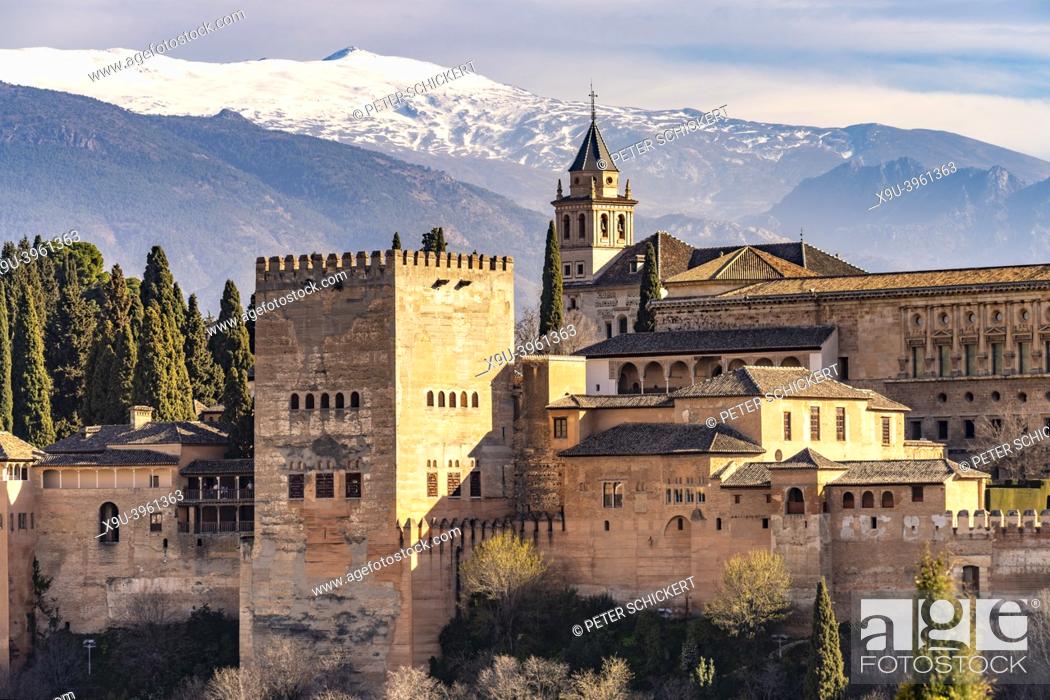 Stock Photo: View from Mirador de San Nicolas to the palace and fortress complex Alhambra and the snow-covered Sierra Nevada mountains in Granada, Andalusia, Spain.