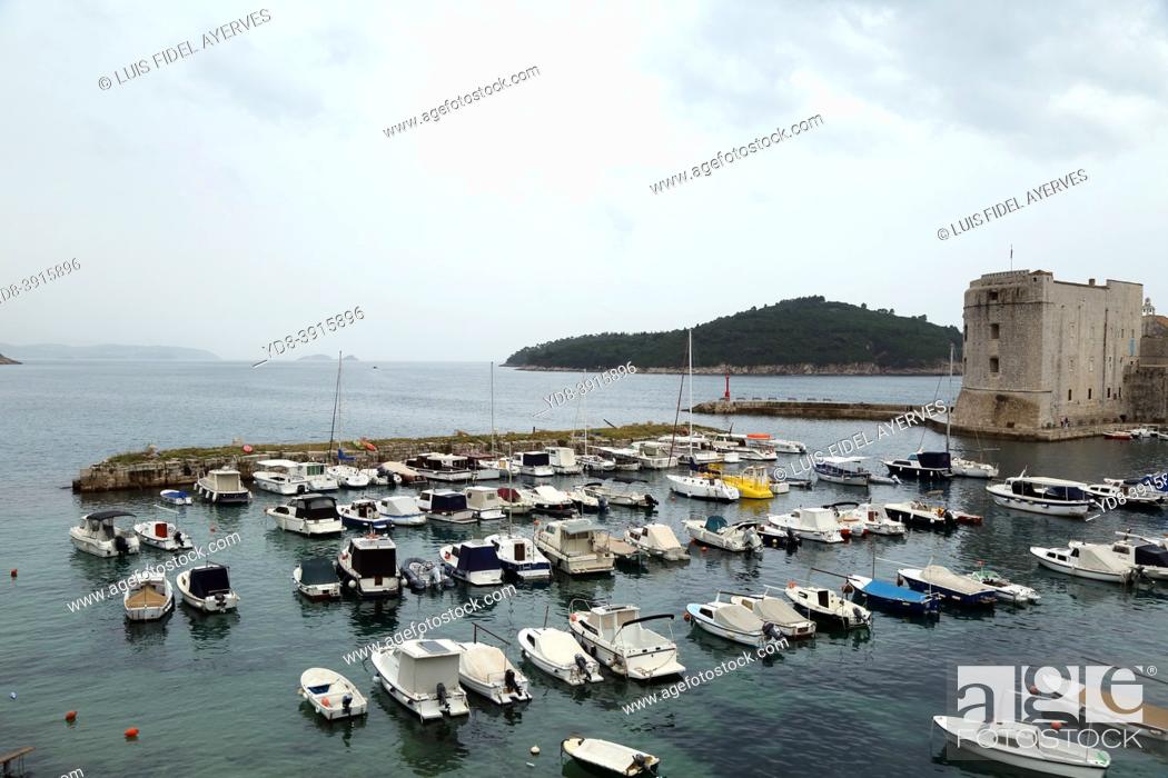 Stock Photo: Dubrovnik is a city in southern Croatia fronting the Adriatic Sea. It's known for its distinctive Old Town, encircled with massive stone walls completed in the.