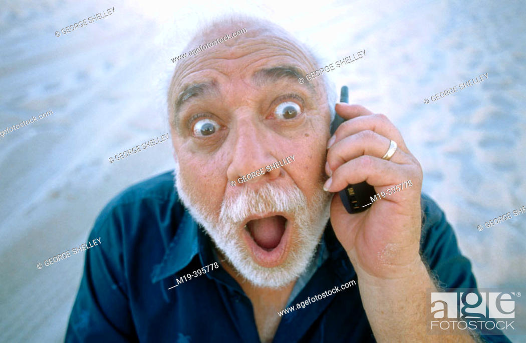 man with funny face/big eyes on cell phone, Stock Photo, Picture And Rights  Managed Image. Pic. M19-395778 | agefotostock
