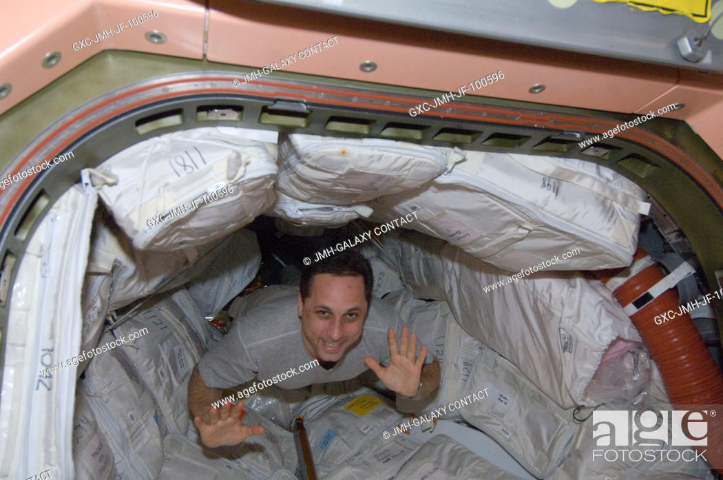 Stock Photo: Russian cosmonaut Anton Shkaplerov, Expedition 30 flight engineer, floats through a hatch into the Unity node of the International Space Station.