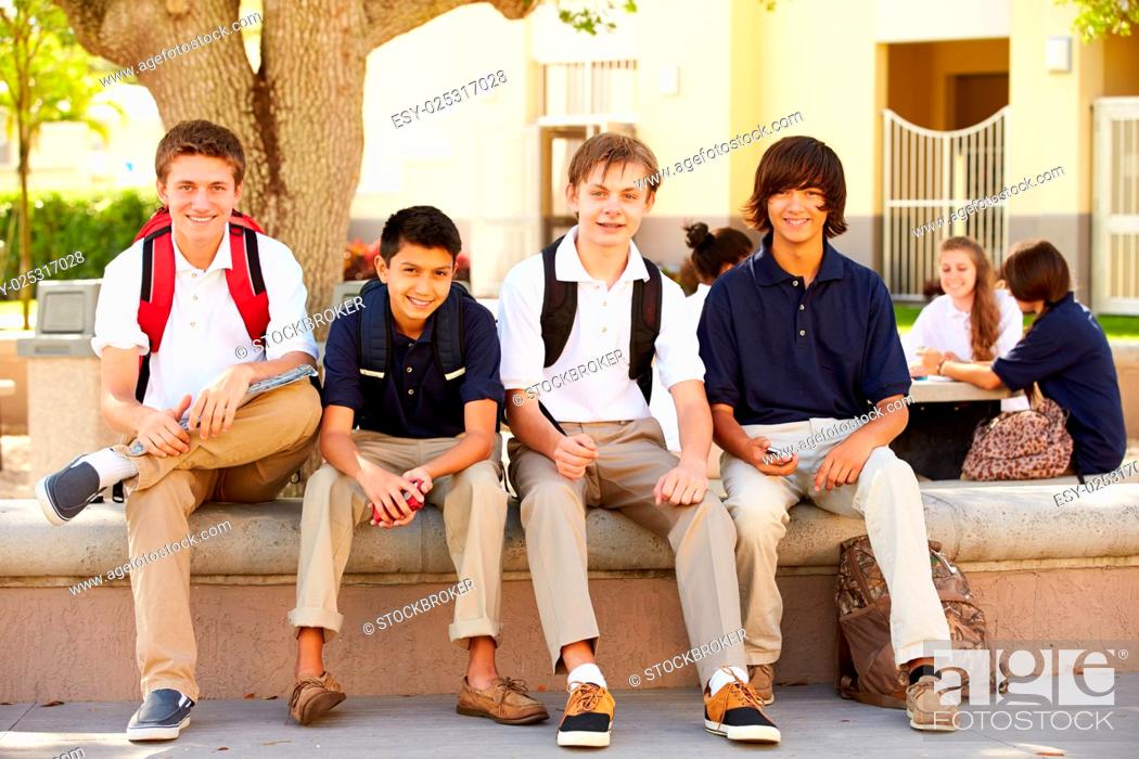 Stock Photo: Male High School Students Hanging Out On School Campus.