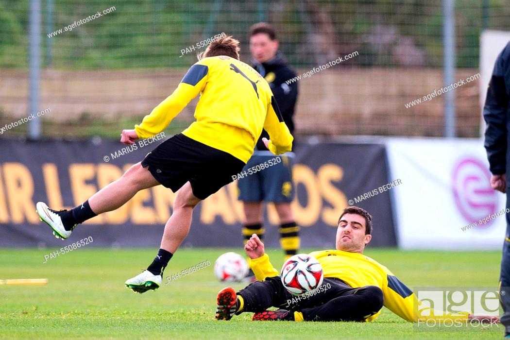 Stock Photo: Borussia Dortmund players Jon Gorenc Stankovic (L) and Sokratis in action during a training session in La Manga, Spain, 16 January 2015.