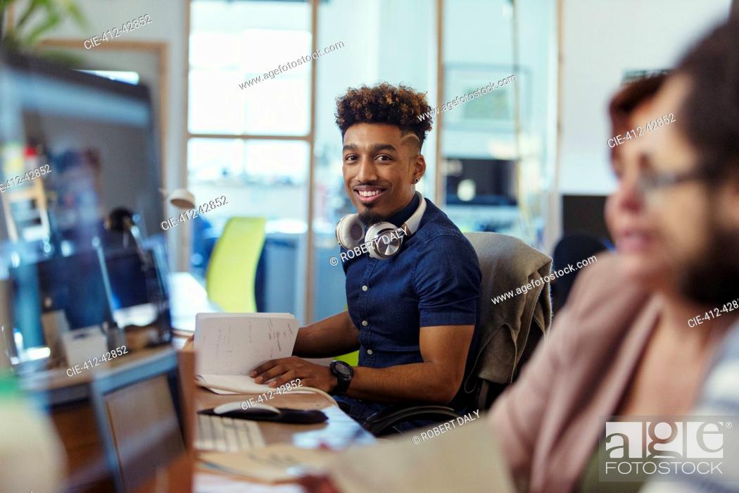 Stock Photo: Portrait smiling, confident creative businessman working in office.