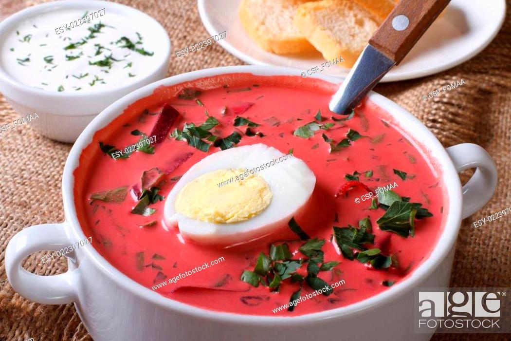 Stock Photo: Cold beet soup with egg and herbs closeup. horizontal.