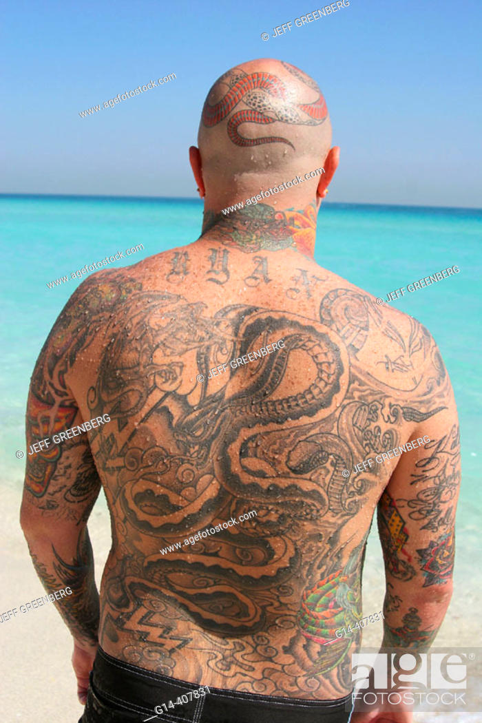 Man covered with tattoos, ocean. Atlantic Shore, South Beach, Miami Beach,  Florida, Stock Photo, Picture And Rights Managed Image. Pic. G14-407831 |  agefotostock