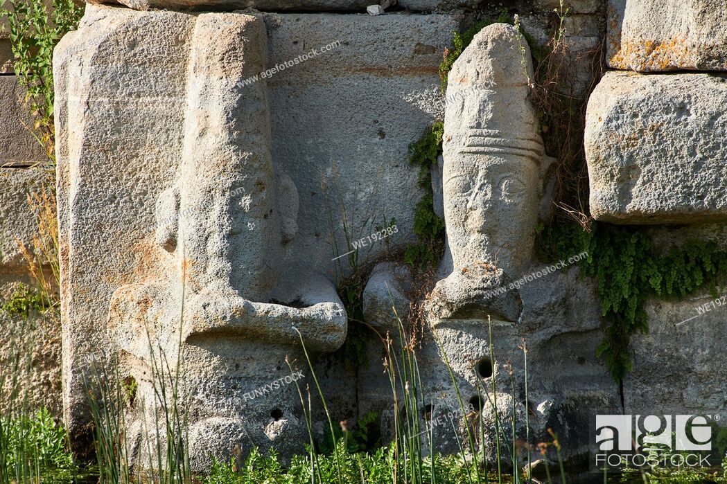 Stock Photo: Close up of lower relief sculptures of Hittite gods at Eflatun P?nar ( Eflatunp?nar) Ancient Hittite relief sculpture monument and sacred pool.