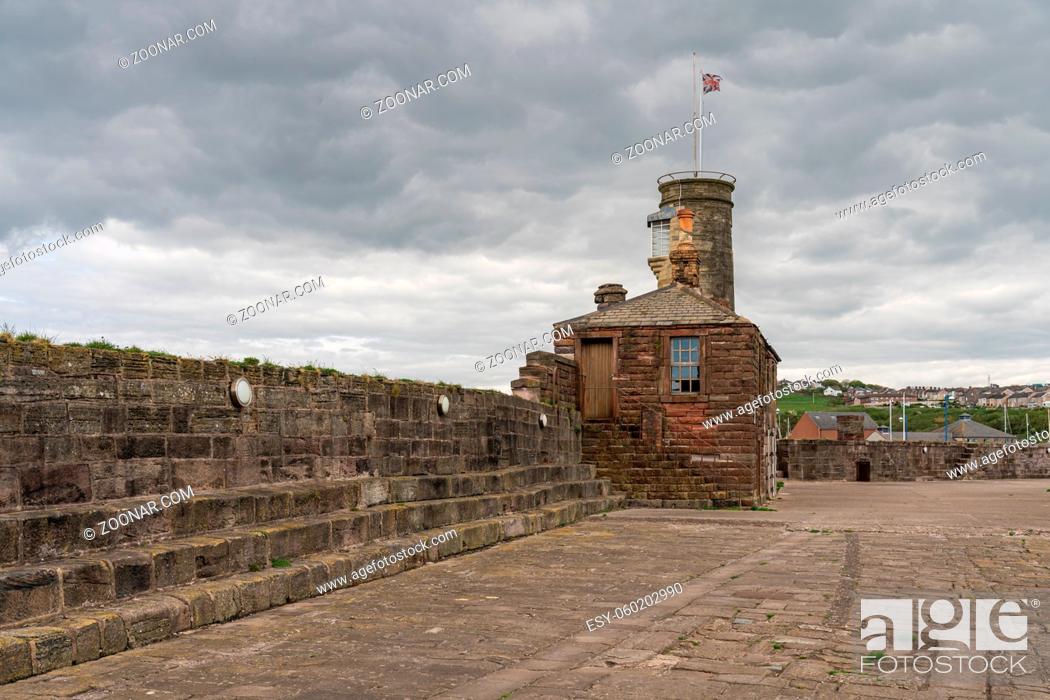 Stock Photo: Whitehaven, Cumbria, England, UK - May 03, 2019: Grey clouds over the buildings on the Old Quay.