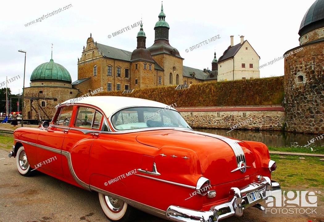 Stock Photo: Castle with oldtimer in Vadstena, Oestergoetland, southern Sweden.