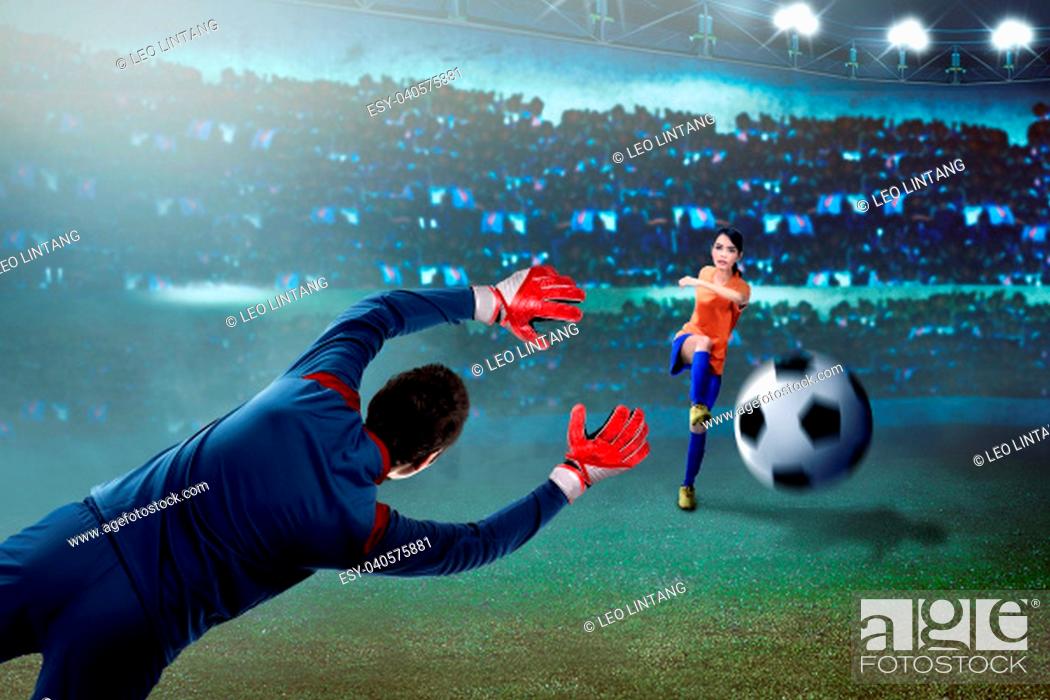 Stock Photo: Professional asian soccer player woman kick the ball to goal on the field.