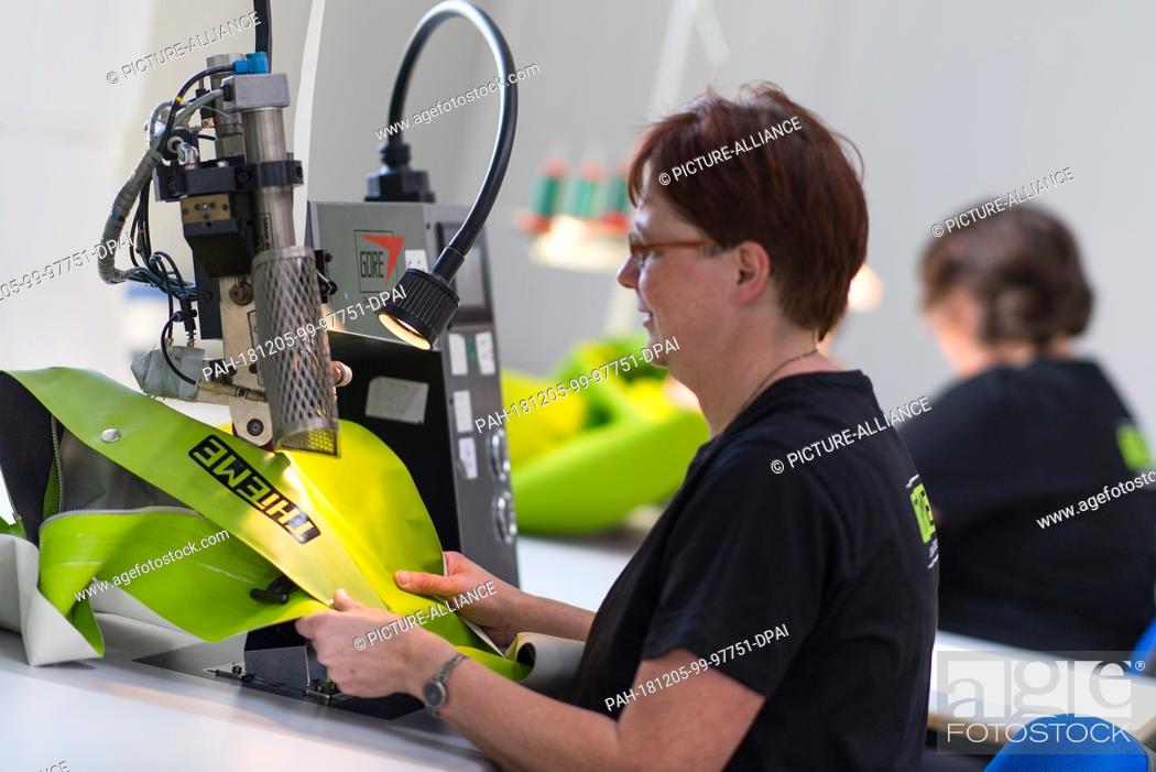 Stock Photo: 05 December 2018, Saxony, Großröhrsdorf: Tailors work in the production of the company Thieme Fashion. At the 15th Industry Day of the Lusatian Textile and.