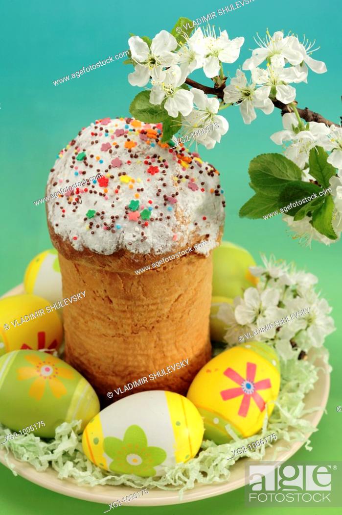 Stock Photo: Russian and Ukrainian Easter: Easter bread, painted eggs and cherry blossom still life.