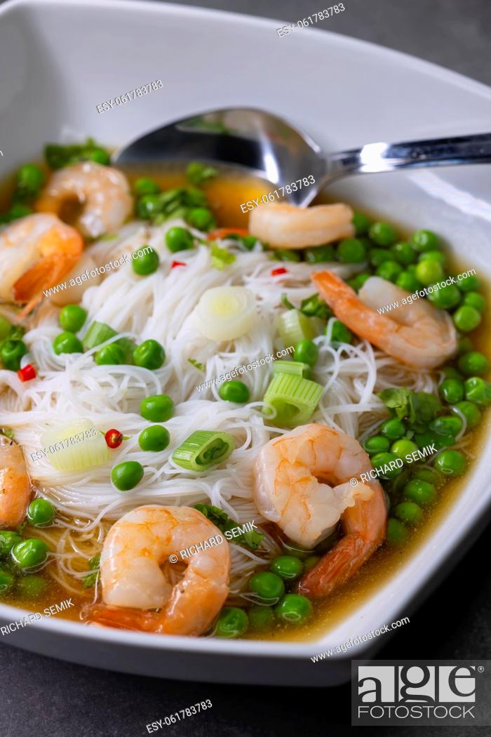 Stock Photo: soup with shrimps, vegetables and rice nooodles.