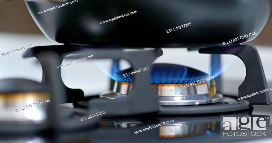 Stock Photo: Stove top burner igniting.