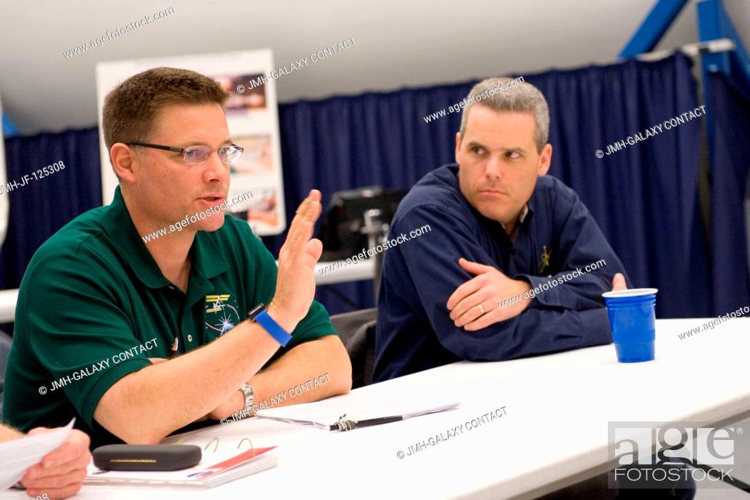 Stock Photo: NASA astronaut Doug Wheelock (left), Expedition 24 flight engineer and Expedition 25 commander, participates in a training session in the Space Vehicle Mock-up.