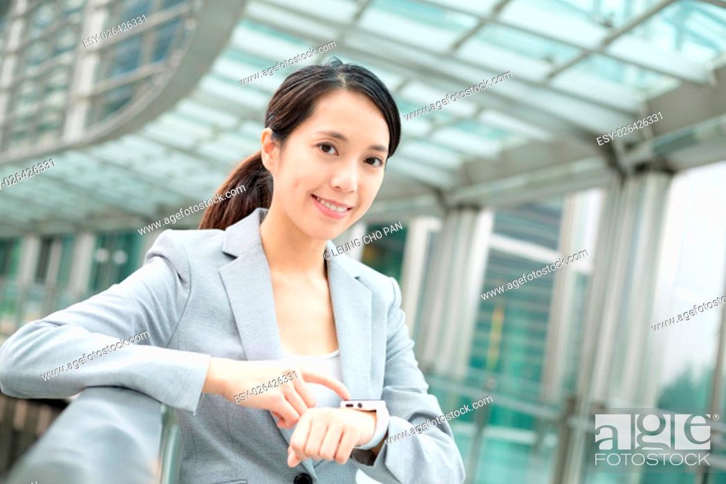 Stock Photo: Business woman use of smart watch.