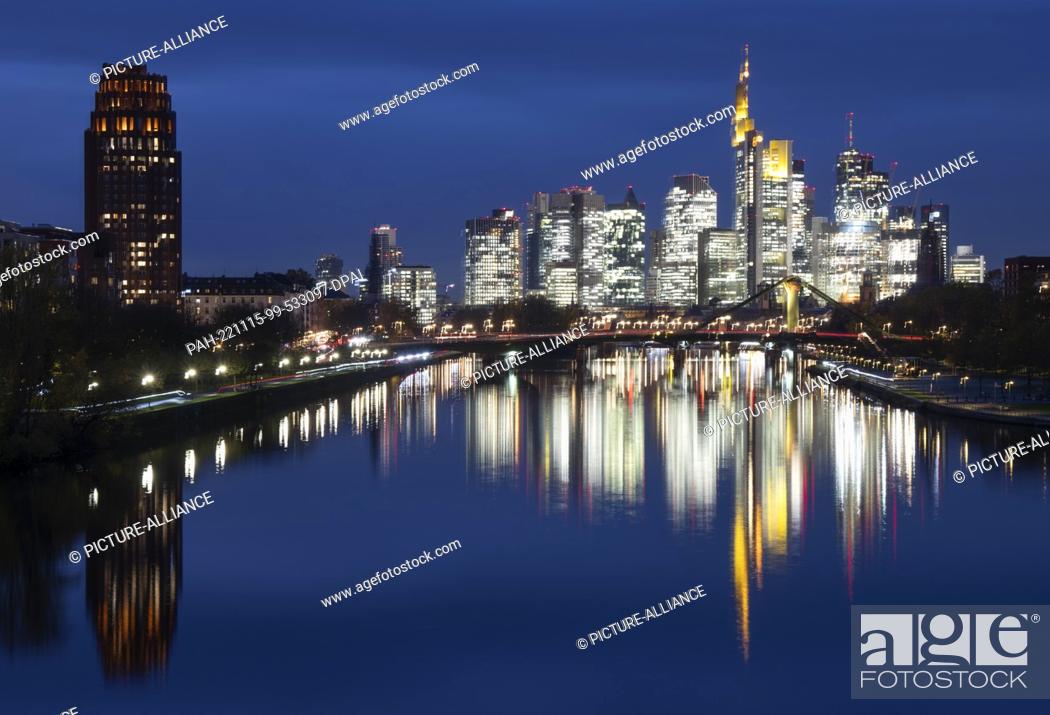 Stock Photo: 15 November 2022, Hessen, Frankfurt/Main: Frankfurt's banking skyline glows in the last light of day. Photo: Boris Roessler/dpa.