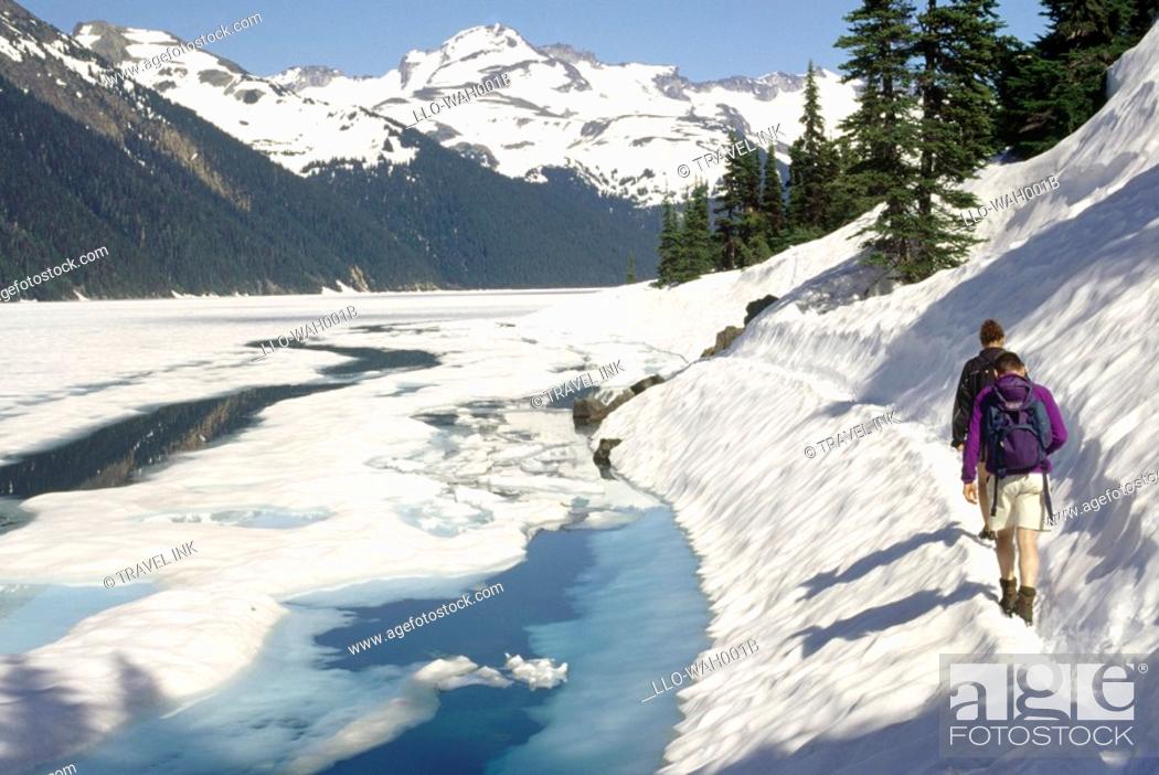 Stock Photo: Hikers Walking Along a Snow Covered Path  Garibaldi Lake, British Columbia, Canada.
