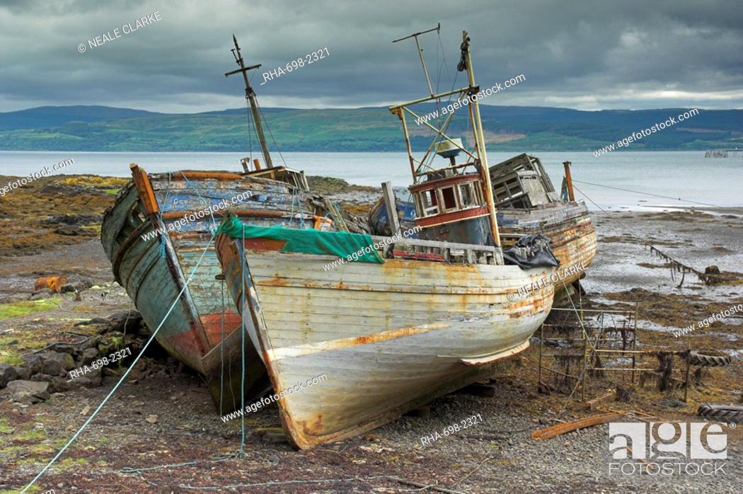 Stock Photo: Wrecked fishing boats in gathering storm, Salen, Isle of Mull, Inner Hebrides, Scotland, United Kingdom, Europe.