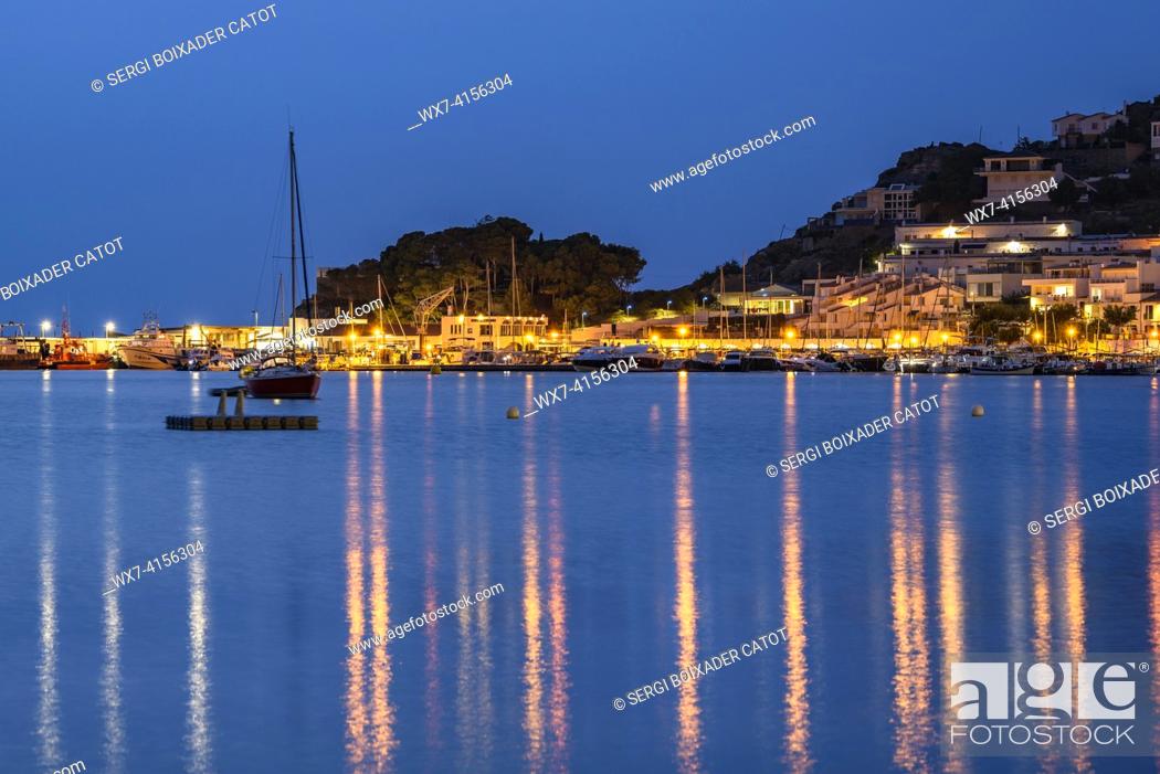 Stock Photo: Harbor and beach of Port de la Selva, illuminated at night in the blue hour (Alt Empordá , Girona, Catalonia, Spain).