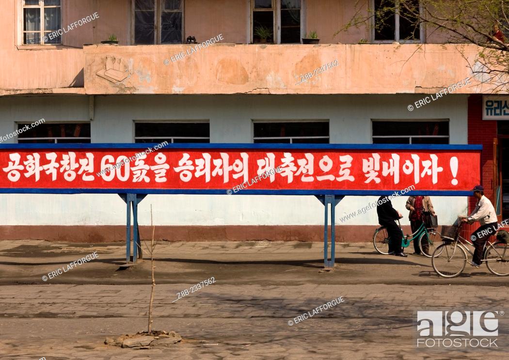 Stock Photo: Propaganda Pannel In The Street, North Korea.