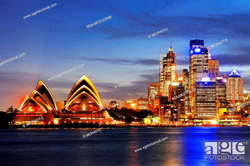 Stock Photo: Skyline of Sydney with Sydney Opera and luxury liner Queen Mary 2 during the blue hour, Circular Quay, Sydney Cove, Sydney, New South Wales, Australia.
