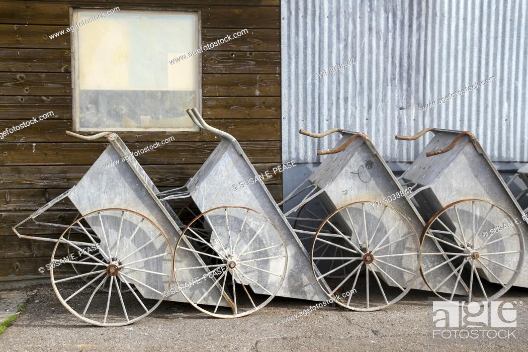 Stock Photo: Wheelbarrows lined up on Municiipal Wharf II, Monterey, California, United States. RM.