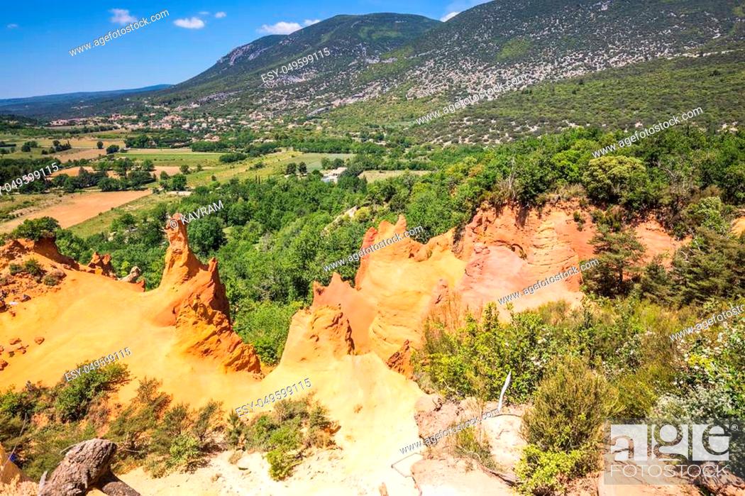 Stock Photo: Languedoc - Roussillon, Provence, France. The reserve - pit on production ochre. Orange and red picturesque hills.