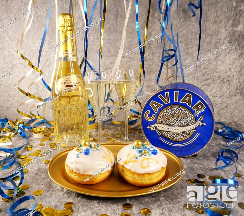 Stock Photo: 30 December 2022, Berlin: Symbolic image on the theme of New Year's Eve, New Year, luxury culinary. A bottle of Champagne Diamant from Vranken Pommery.