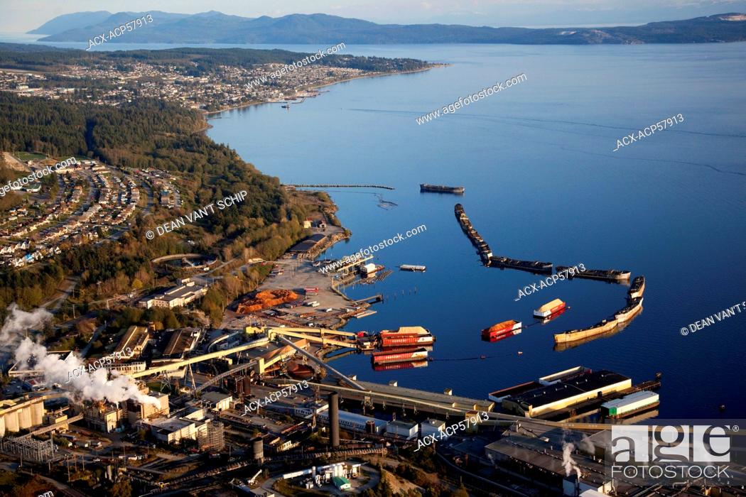 Stock Photo: Aerial, Pulp Mill, Chip Barges, Hulks Breakwater Ships, Westview and Powell River, British Columbia, Canada.