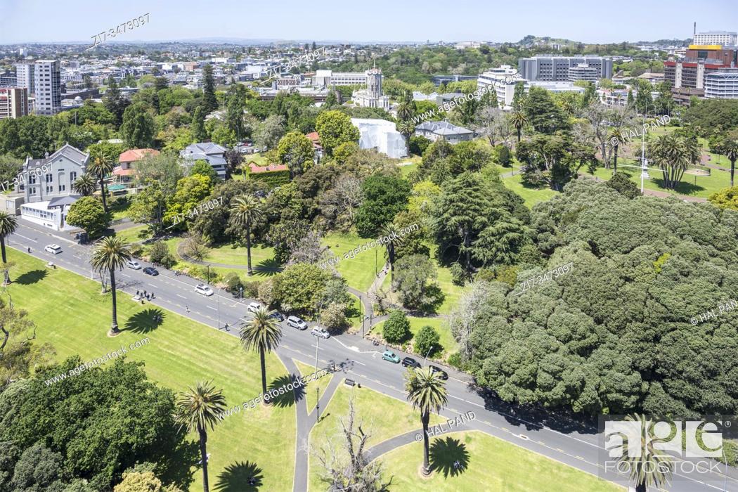 Stock Photo: AUCKLAND, NEW ZEALAND - November 05 2019: cityscape from above of lush vegetation at Albert park, shot in bright late spring light on november 05 2019 at.