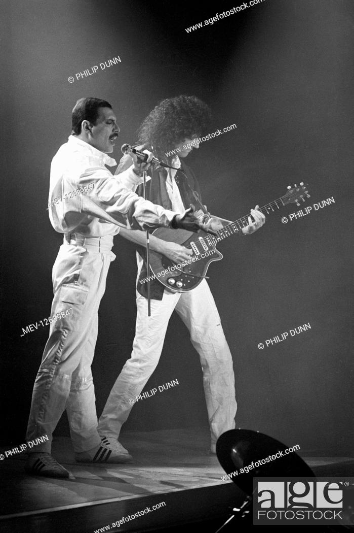 Stock Photo: Freddie Mercury with lead guitarist Brian May. Queen recording a video for Friends Will Be Friends, London.