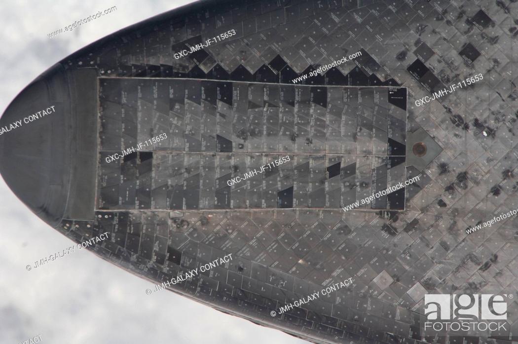 Stock Photo: This underside view of the nose of space shuttle Endeavour was provided by an Expedition 27 crew member during a survey of the approaching STS-134 vehicle prior.