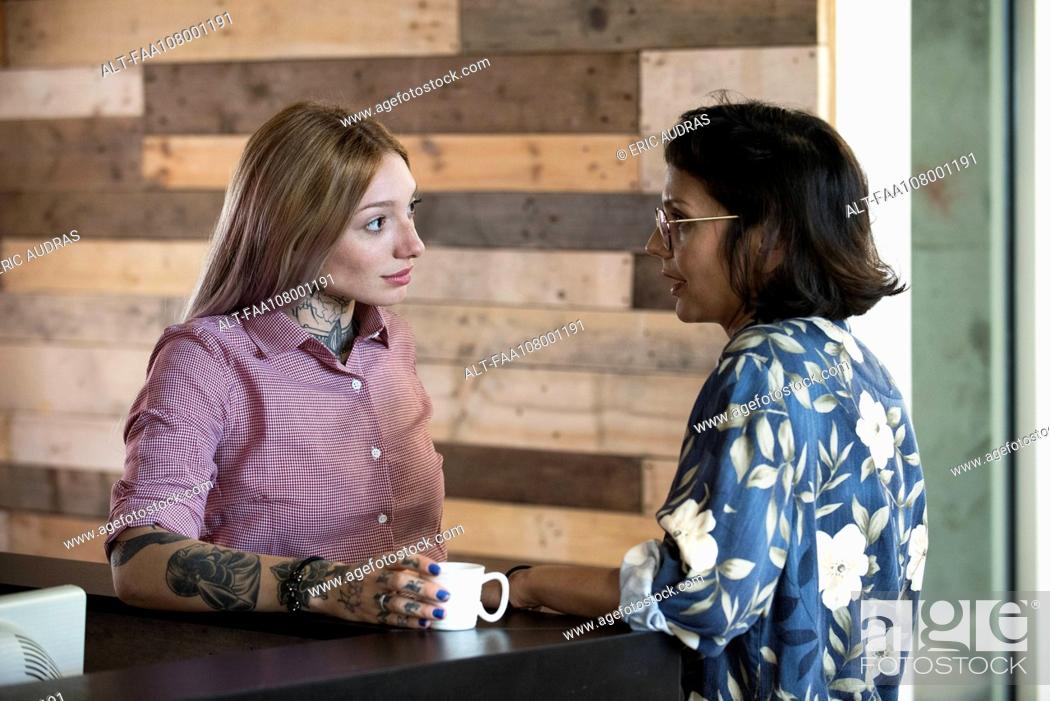 Stock Photo: Women chatting during coffee break.