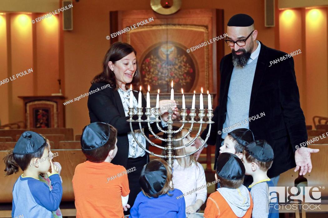 Stock Photo: Rabbis Lauren Holtzblatt and Aaron Alexander talk with pre-schoolers about lighting the menorah the day before Hanukkah starts at the Adas Israel Congregation.