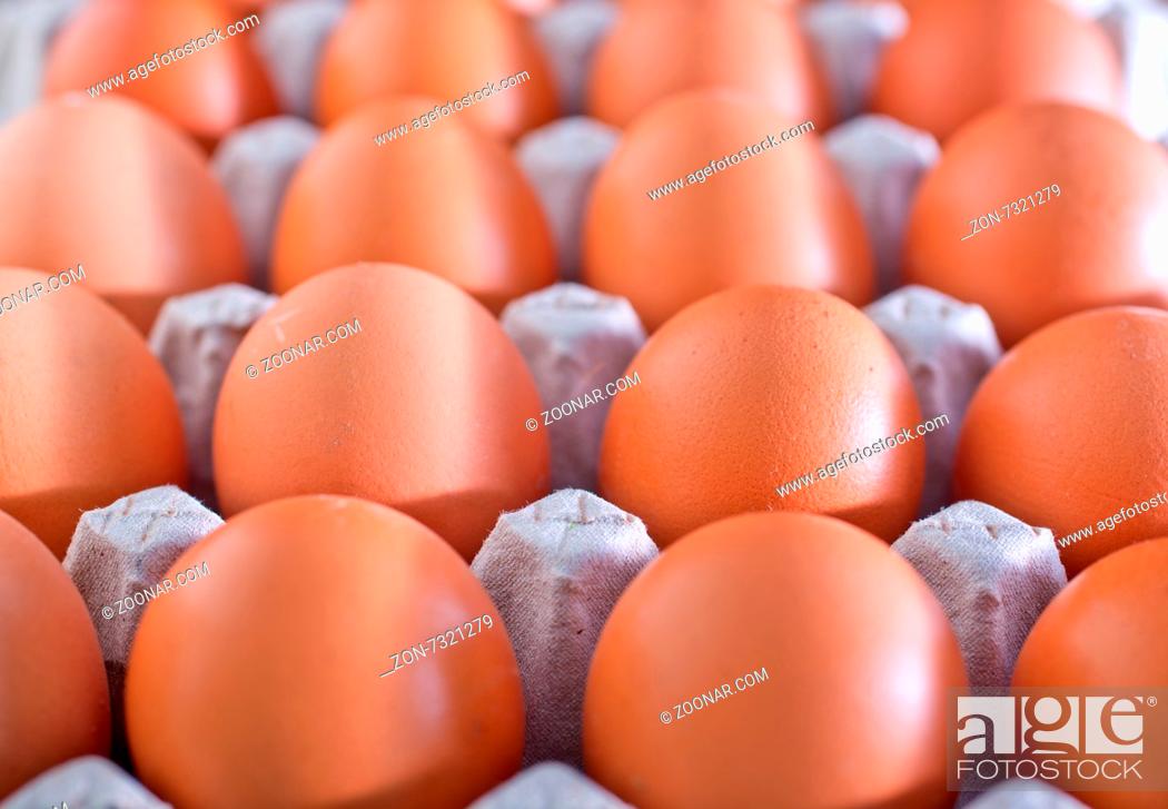 Stock Photo: raw brown eeg, chicken eggs on a table.