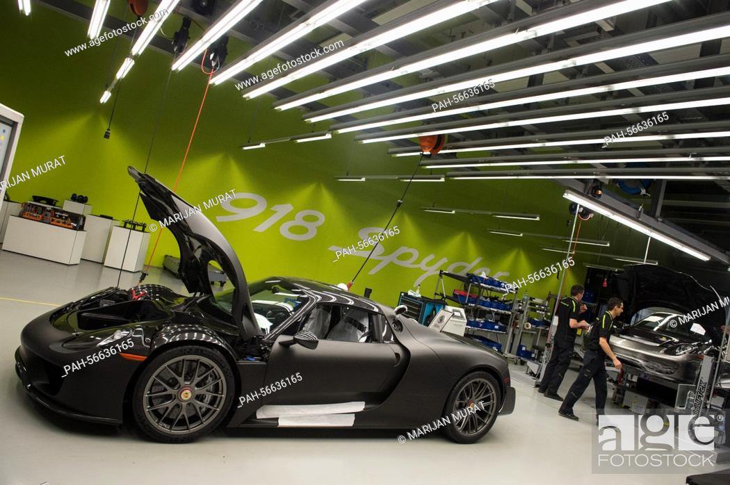 A Porsche 918 Spyder Stands In A Factory Hall Of The Porsche