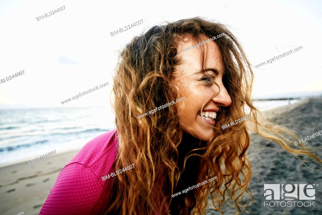 Wind blowing hair of Caucasian woman on beach, Stock Photo, Picture And  Royalty Free Image. Pic. BIM-BLD244007 | agefotostock