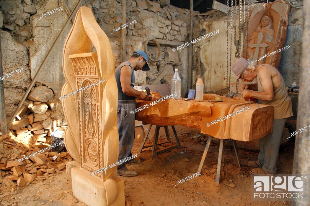 Stock Photo: Khachkars are made by hand by skilled stonemasons. The Armenian stone crosses (Khachkars) have a pre-Christian origin. They have no equivalent in the rest of.