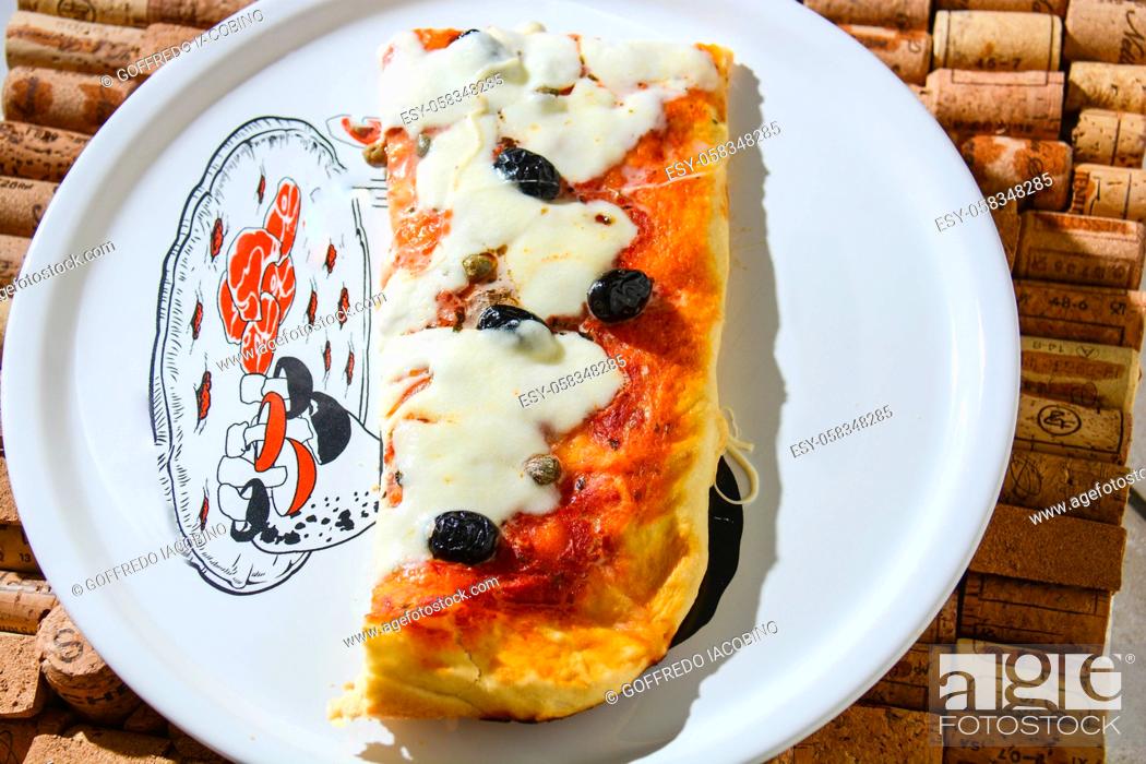 Stock Photo: pizza stuffed with olives and Italian tomatoes.