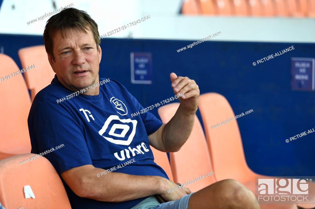 Stock Photo: PRODUCTION - 18 July 2022, Bremen: Torsten Gütschow, coach of Bremer SV, during an interview. (to dpa ""Lucky break"" Bremen: ex-goal scorer Gütschow coaches.