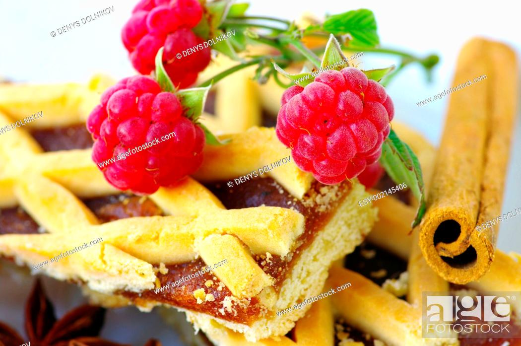 Stock Photo: Plum cake with raspberry and stick of cinnamon.