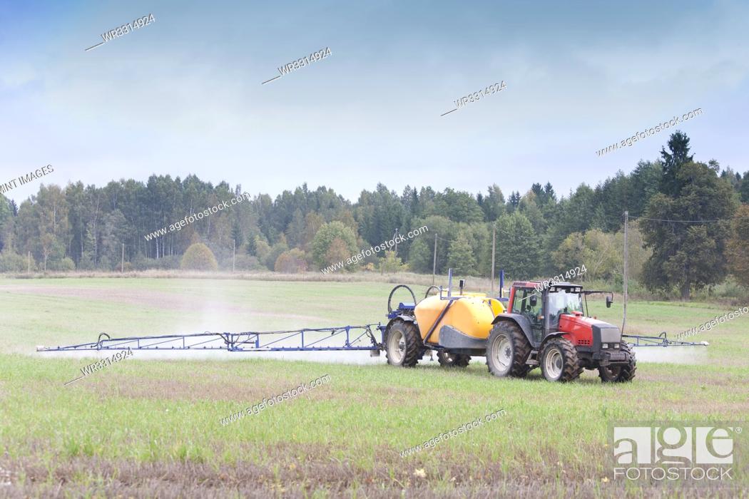 Stock Photo: Tractor Spraying Herbicide.