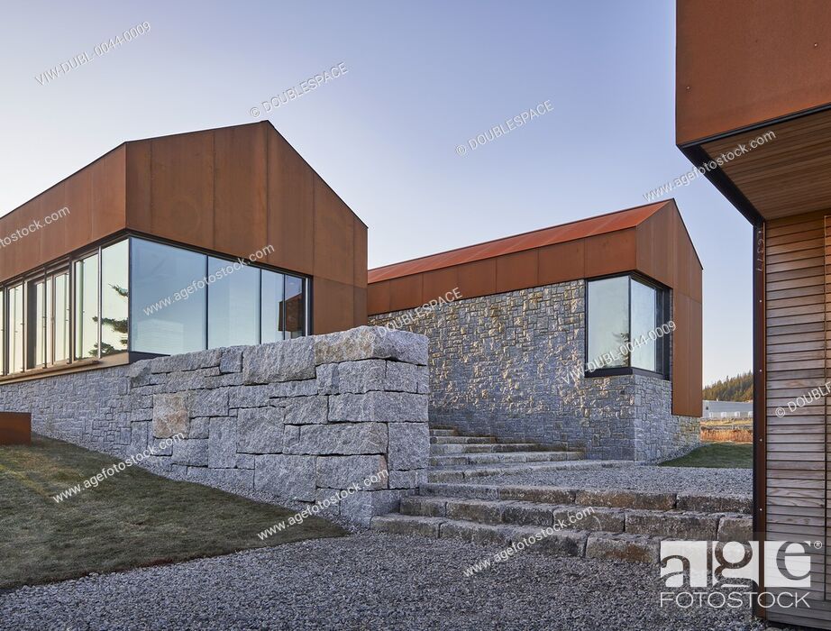 Stock Photo: Assembly of three-building-complex with stone stairs. Smith Residence, Kingsburg, Canada. Architect: MacKay-Lyons Sweetapple, 2018.