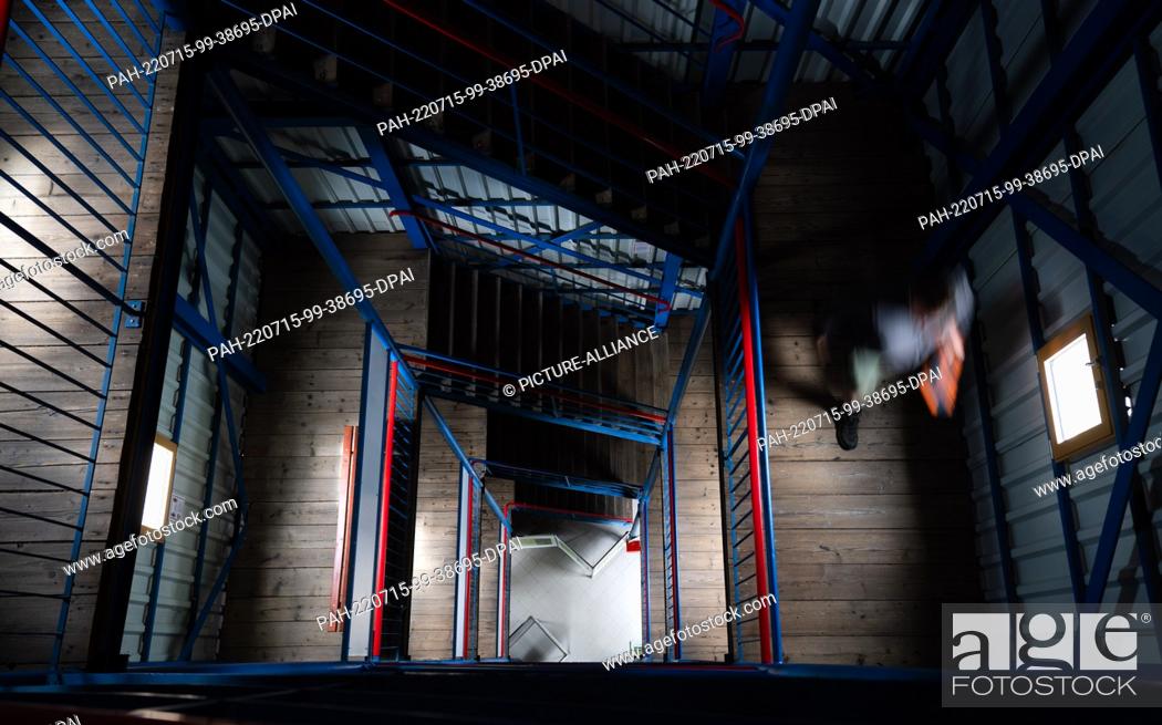 Stock Photo: 15 July 2022, Bavaria, Ludwigsstadt: A man walks down the stairs of the Thüringer Warte observation tower. Photo: Nicolas Armer/dpa.